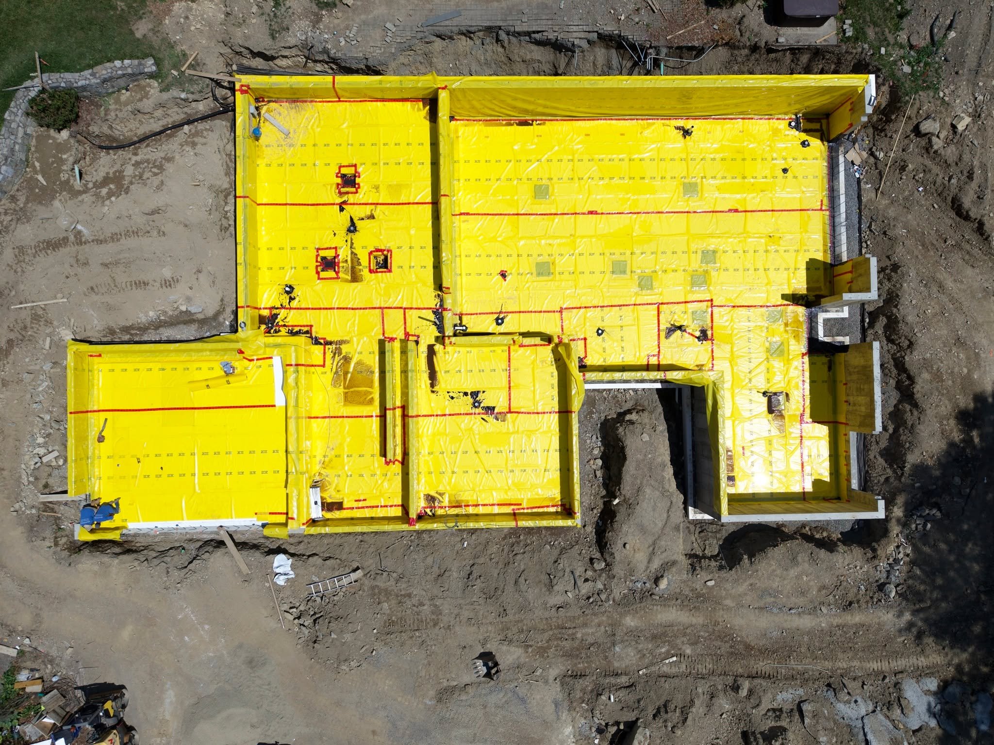 From above, the Jaycox Pond House is beginning to reveal its form.

Even at this early stage, every decision from the foundation layout to the building envelope is guided by a commitment to durability, energy performance, and thoughtful integration w