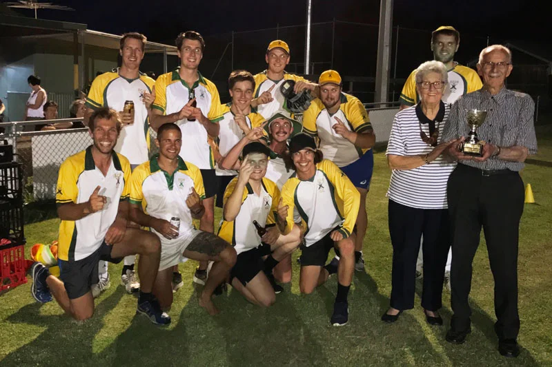 The winning cricket team with Cracker’s parents, and the Crackers Cup.