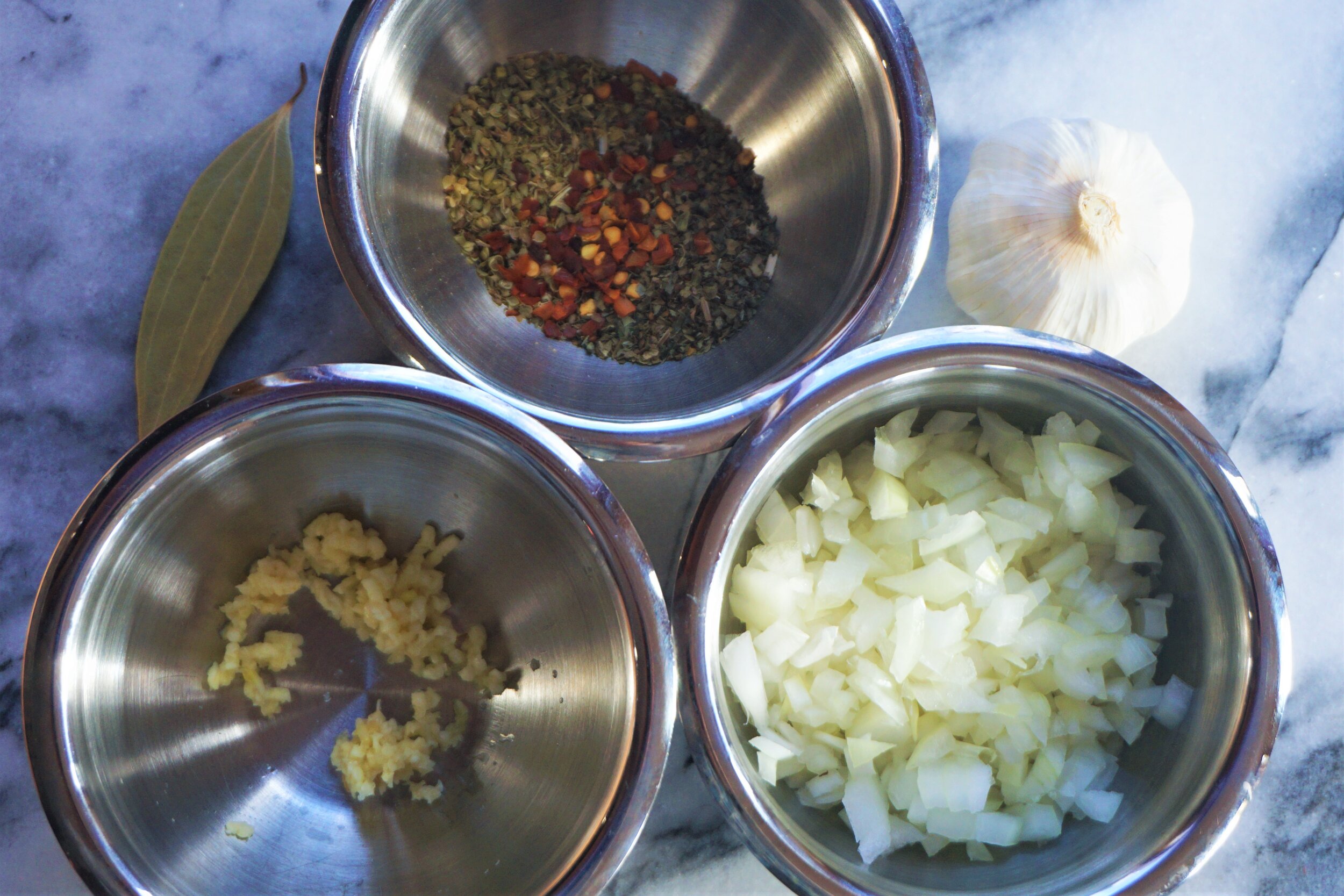 Diced onion, crushed garlic and spices are the first ingredients into the saucepan, so it's a good idea to have them prepped.