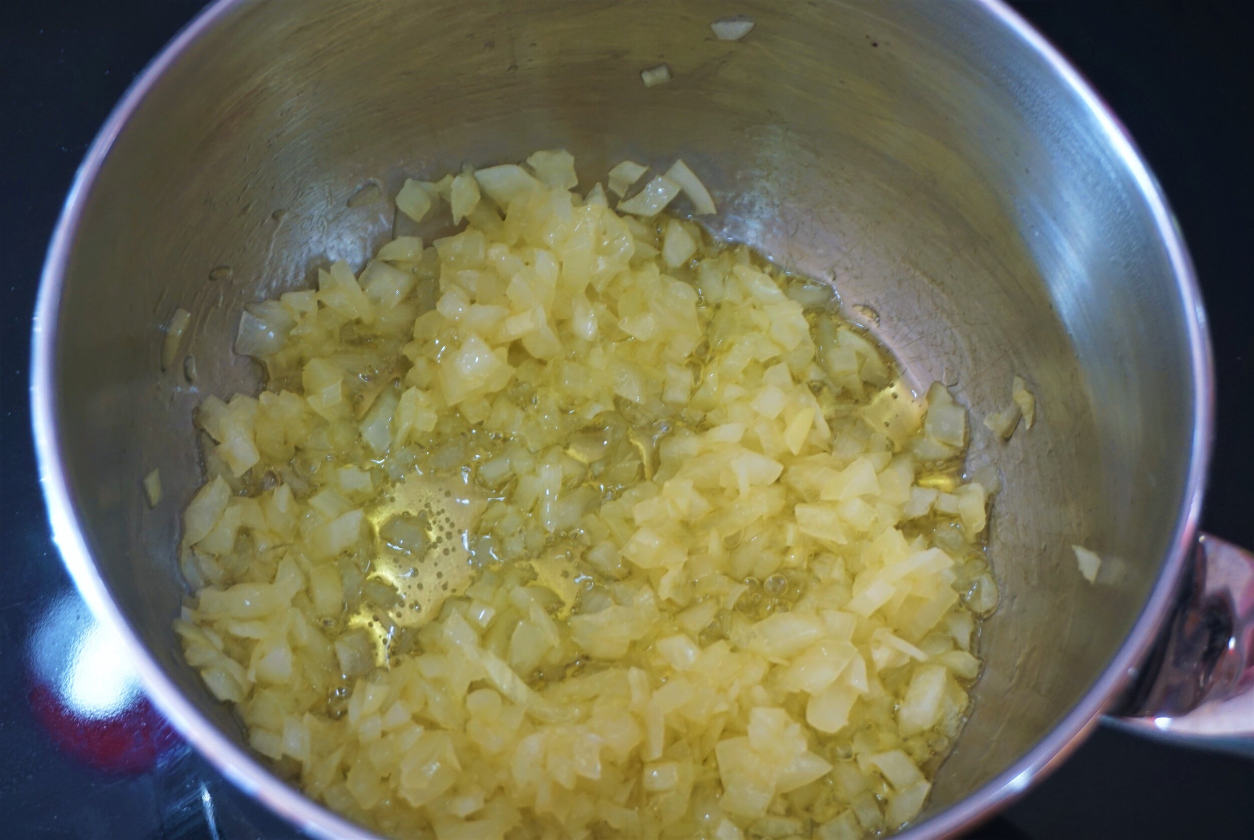 Cook the diced onion in olive oil until transluscent.