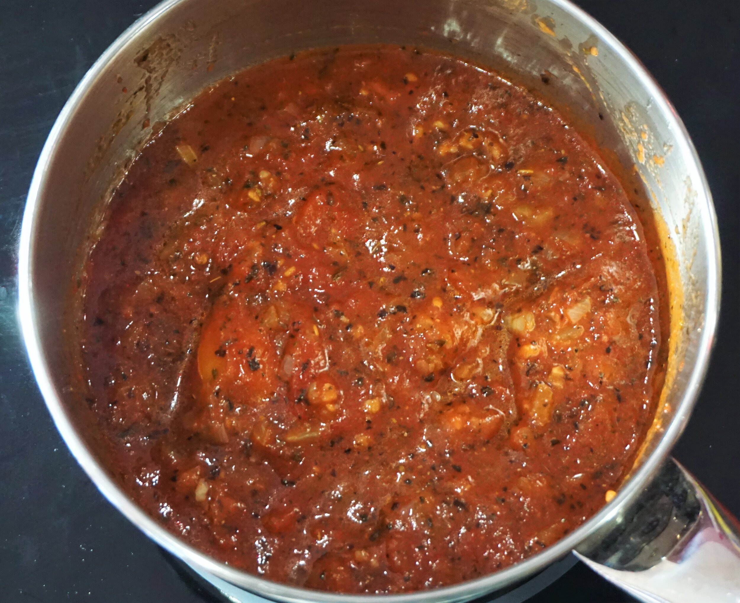 The tomatoes will still be lumpy at the beginning, but wil loosen up as you cook.