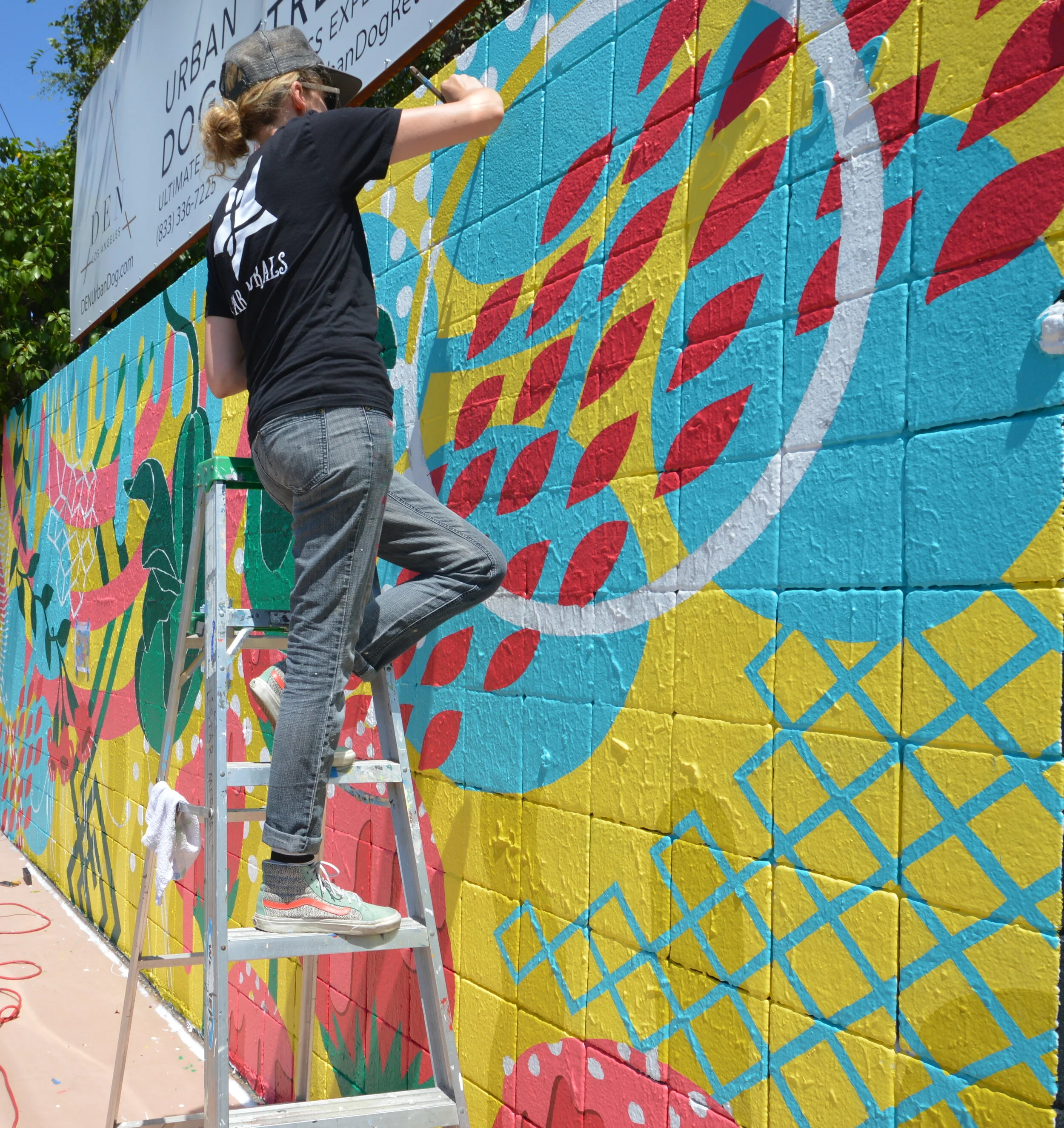 L Star painting an abstract mural in Cypress Park
