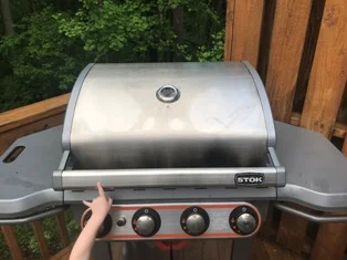 Grill cover off! Let's do it. Oh yeah . . . I gotta open it.