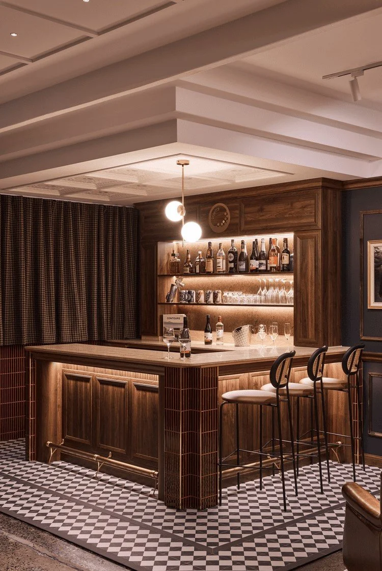 Luxury clubhouse bar interior in Sydney designed by Al and Co Haus of Design, featuring dark timber cabinetry and pendant lighting.