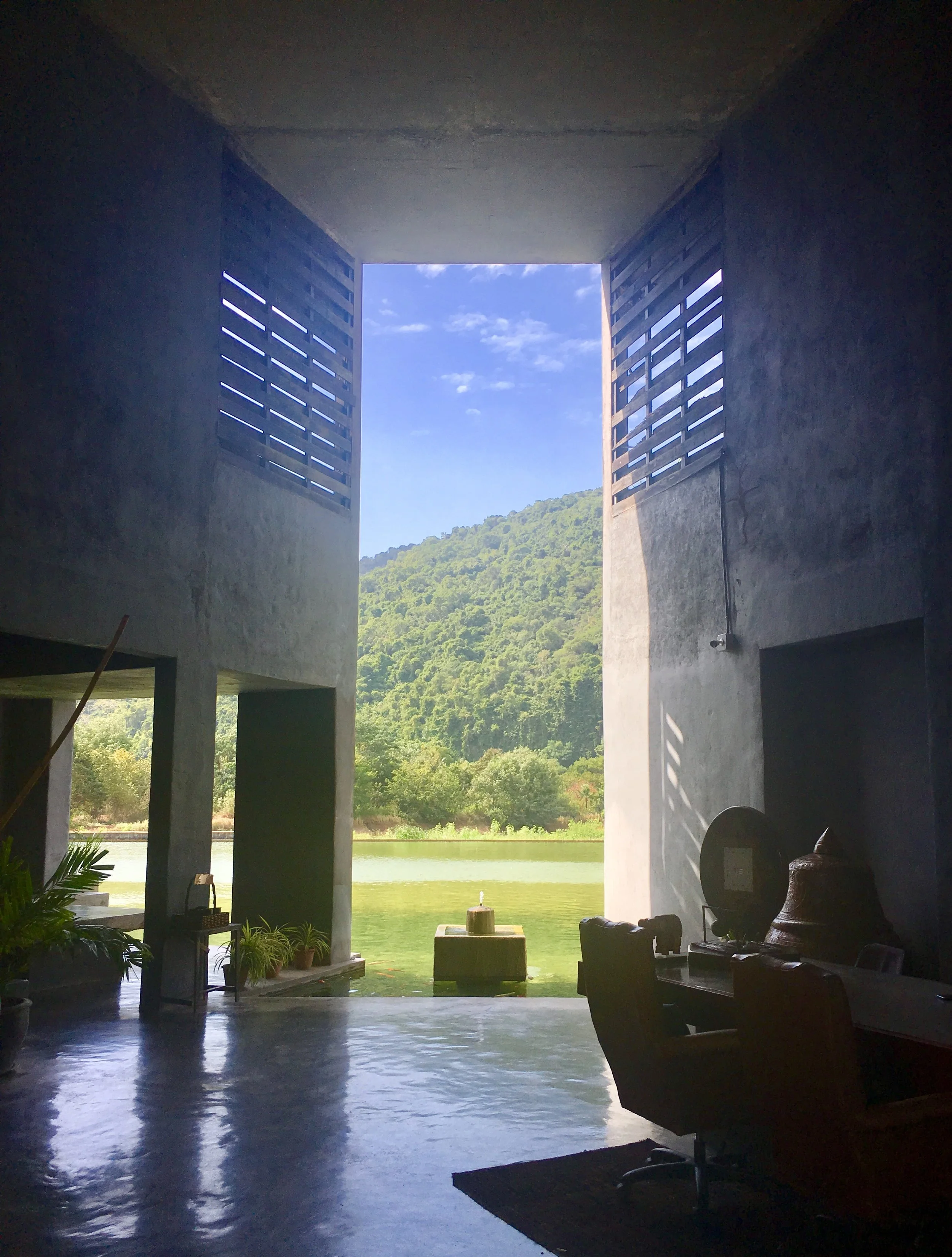 View out through the open-air lobby from the check-in desk