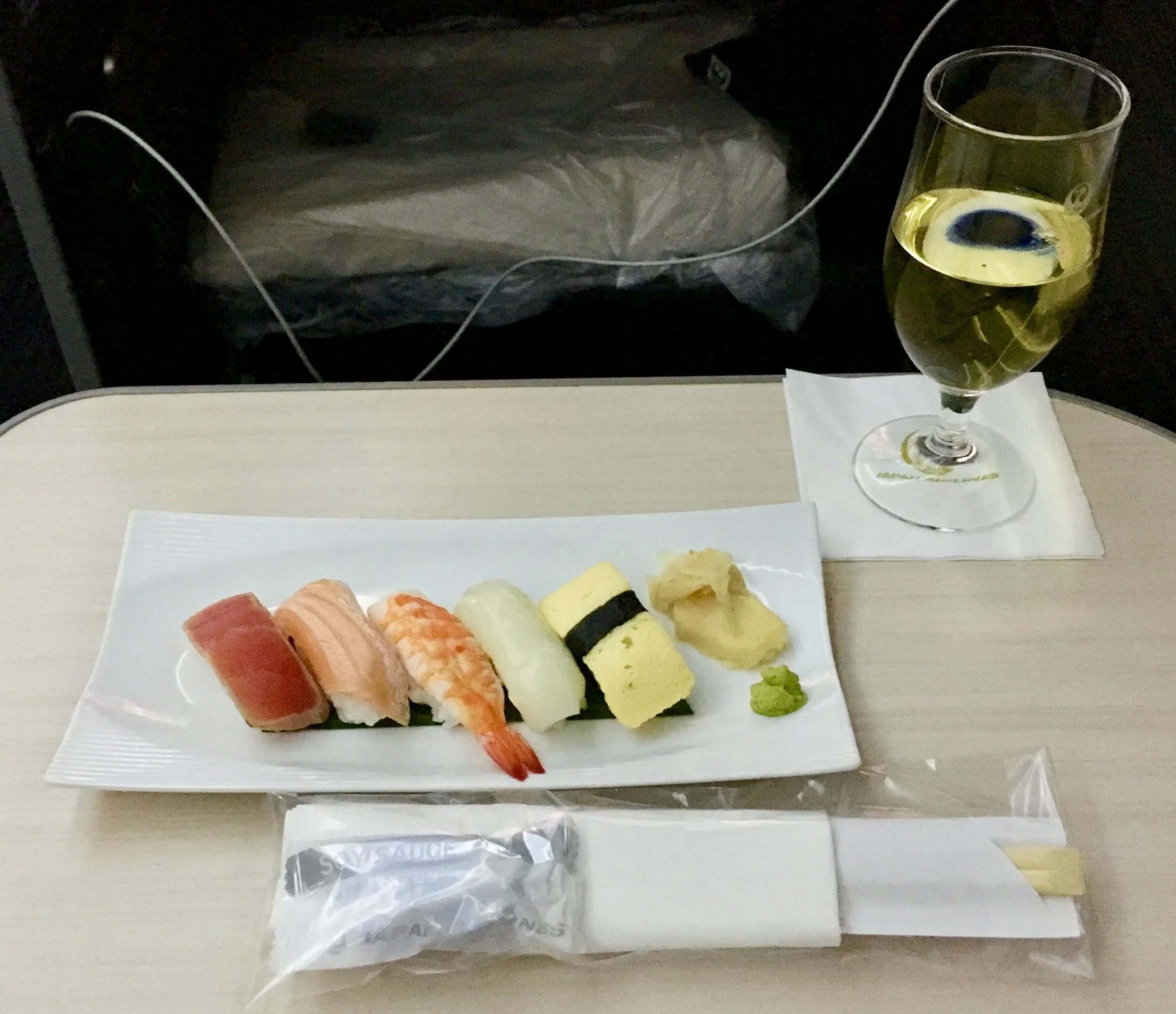 Sushi and/or nuts was served about 30 minutes after take-off, the full extent of any food offered on the flight before breakfast. I maximized what I could with the addition of some okay Charles Heidsieck champagne.