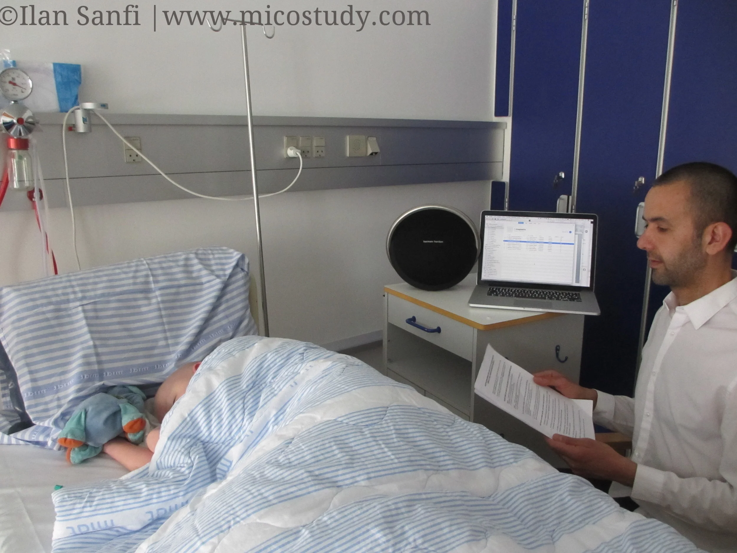 Ilan Sanfi reading one of the music imagery narratives for a 10–year–old boy in cancer treatment. The loudspeaker plays the specially composed music for that specific music narrative.