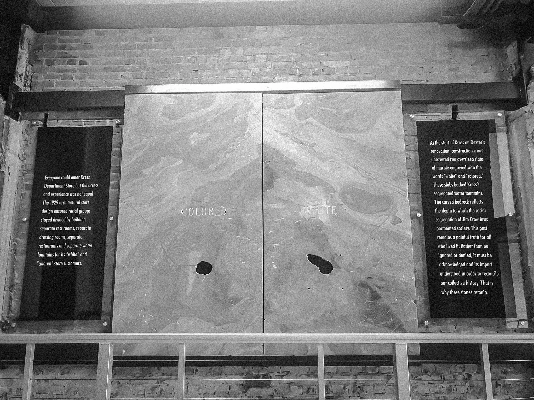 Historic colored water fountain sign at Kress on Dexter. S.H. Kress Co. was a department store chain. Whites were allowed to use the front entrance, while blacks had to enter through the back so they wouldn't be seen by white clientele entering the store. The worlds "colored" and "white", literally etched in stone, serve as a reminder and acknowledgement of the building's segregated past.