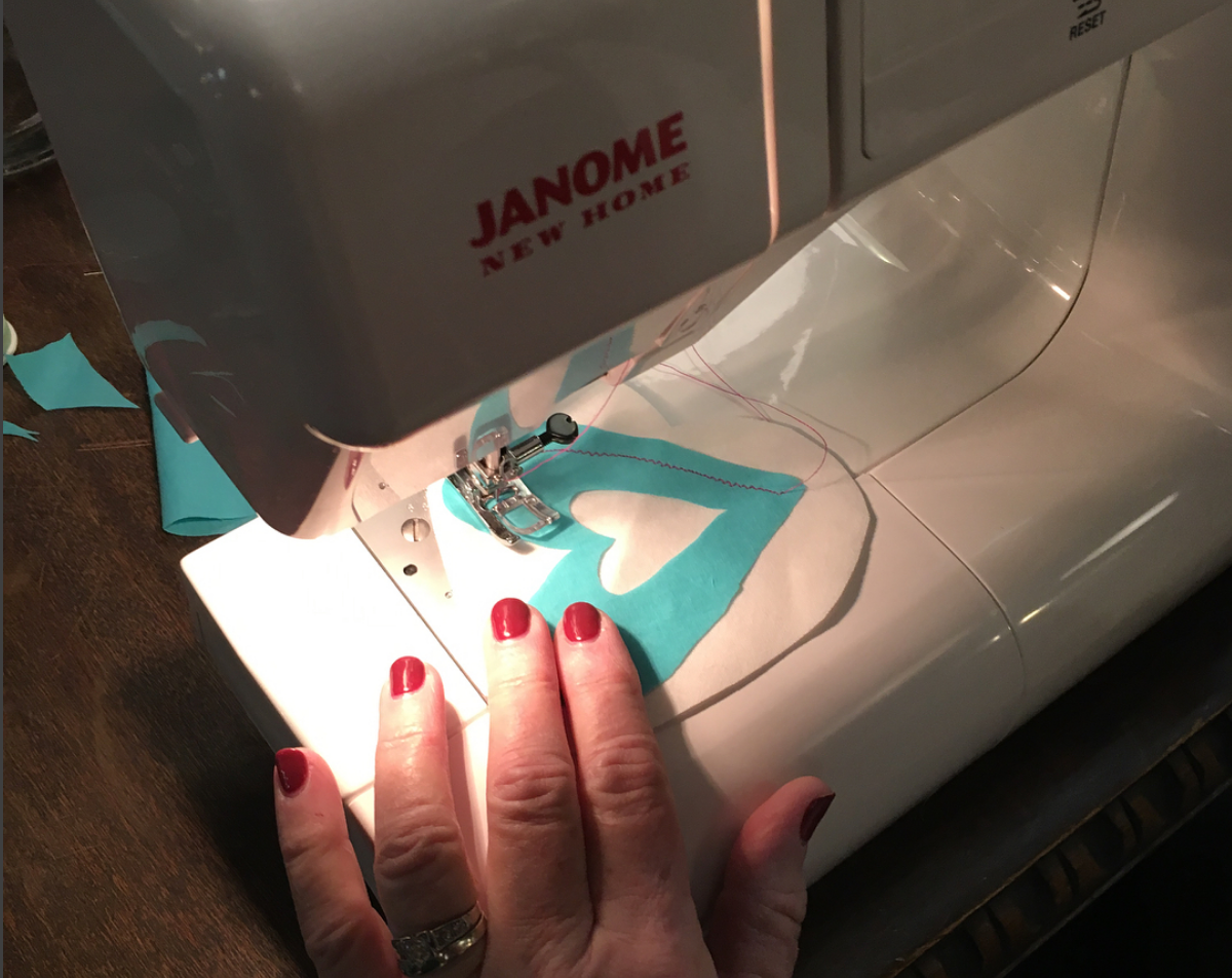 sewing a heart.png