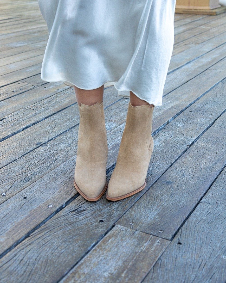 THE Suede booties we'll be wearing on repeat all season! 👢 Shop our shoes at Envie Boutique.