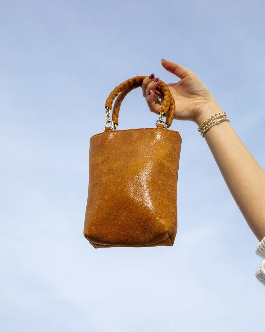 She&rsquo;s mini, but she is the moment. ✨
Carry it your way&mdash;top handle or hands-free, either way, she&rsquo;s coming with you.

Shop the Tennessee Mini Bag at Envie Boutique.