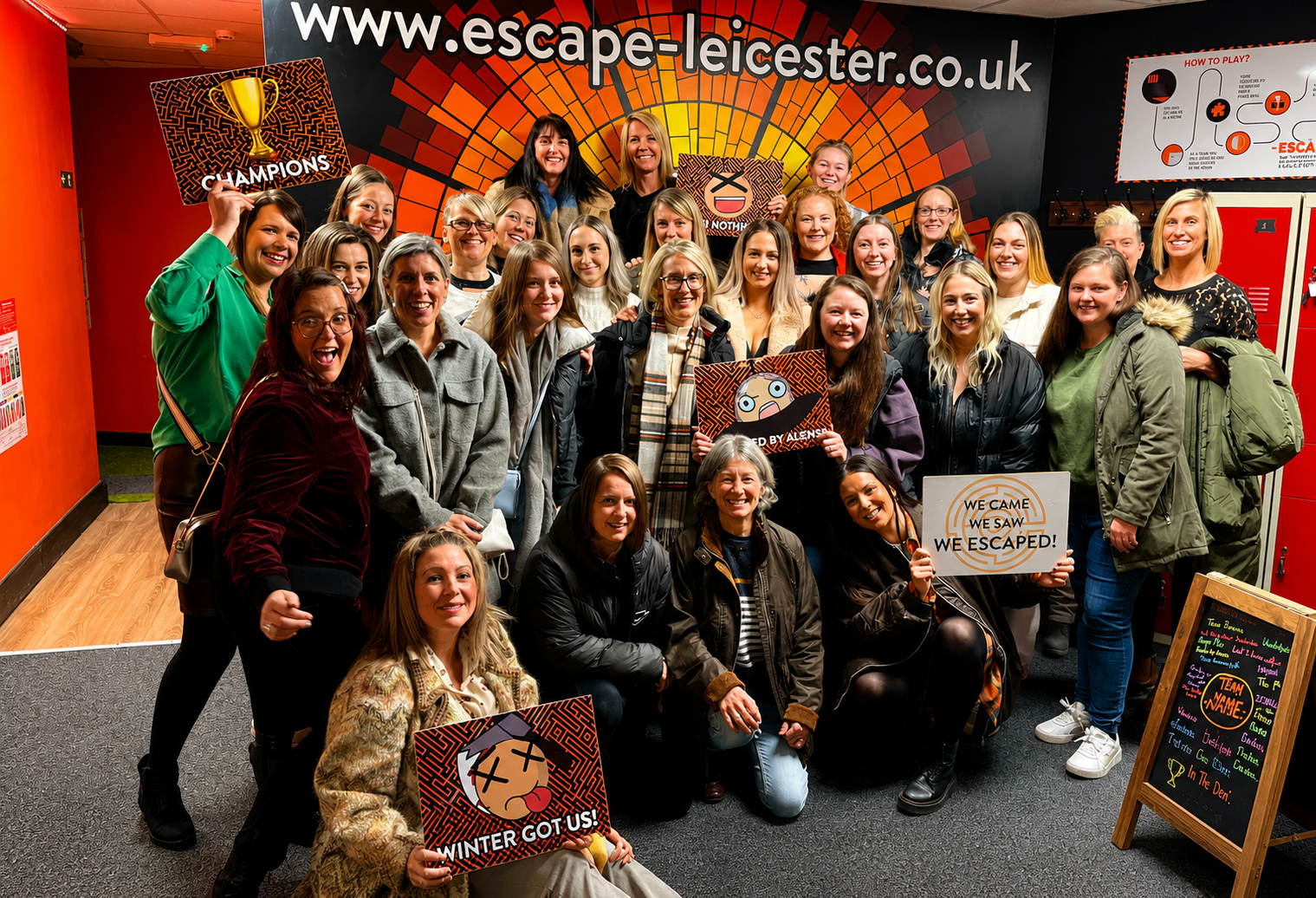 Group of players celebrating after completing an escape room challenge at Escape Leicester