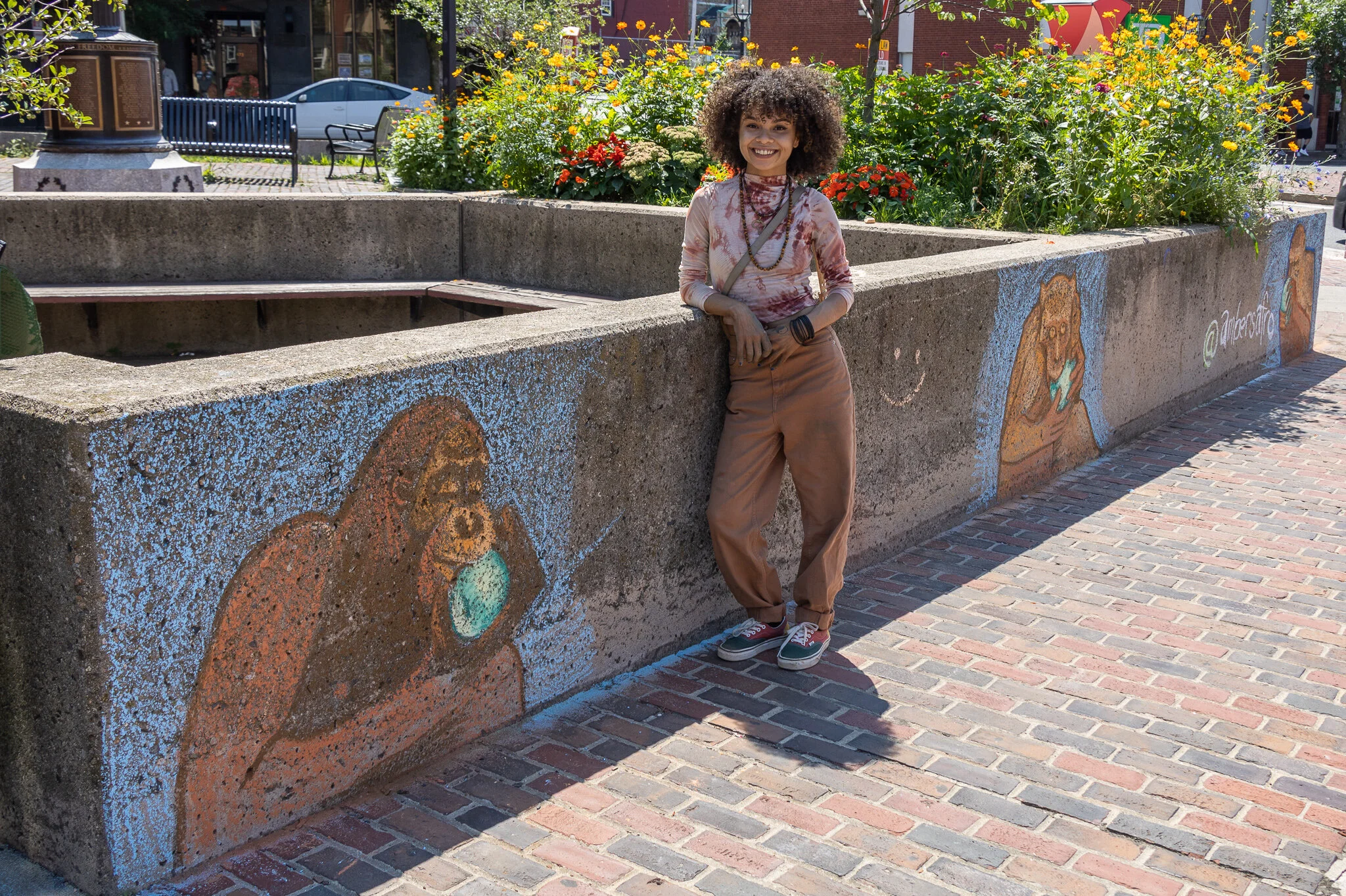 Amber Torres poses next to her Chalk Art Mural during our second week session. (photo: Matt Frank)
