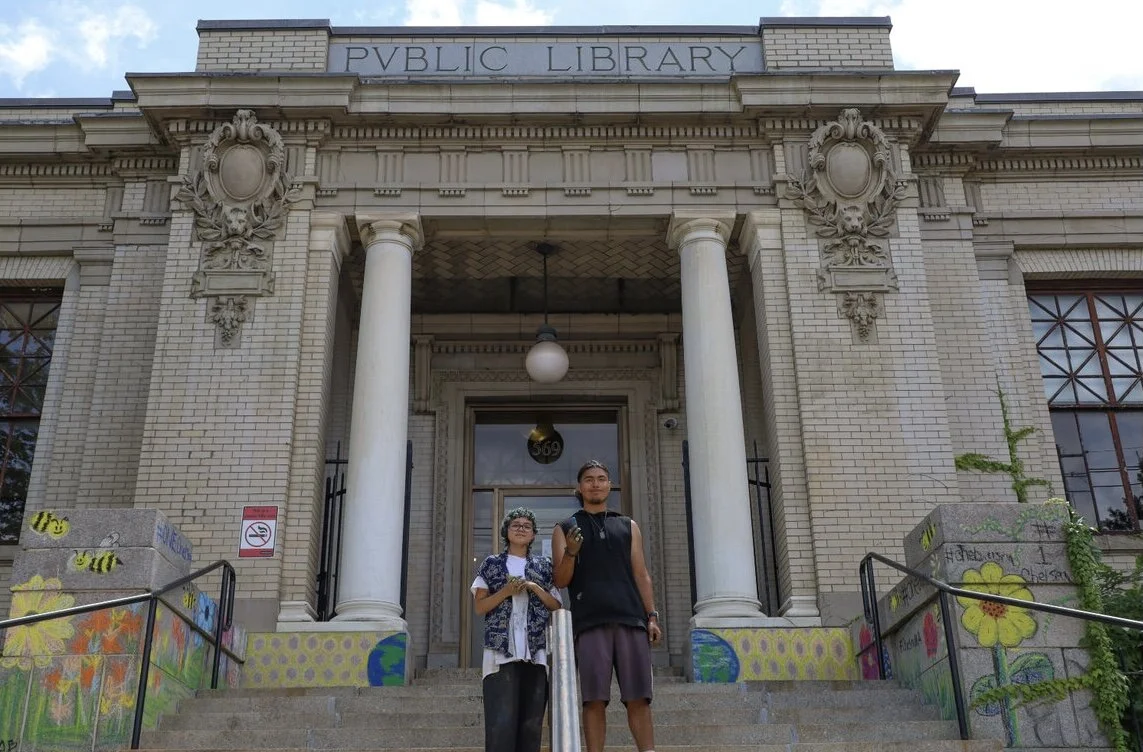 Aliyah Saldana-Oswald (left) and Oscar Figueroa Sierra (right) in front of the Chelsea Public Library. (photo: Matt Frank)