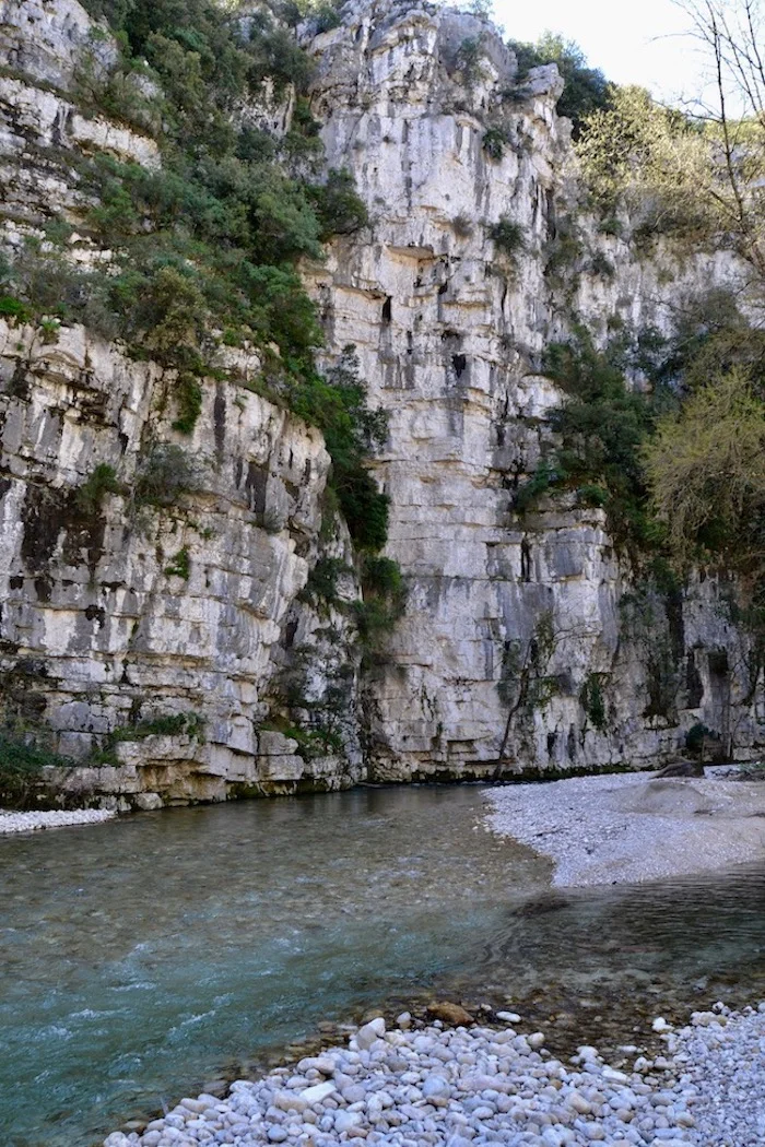 A cliff rises high over the river Loup