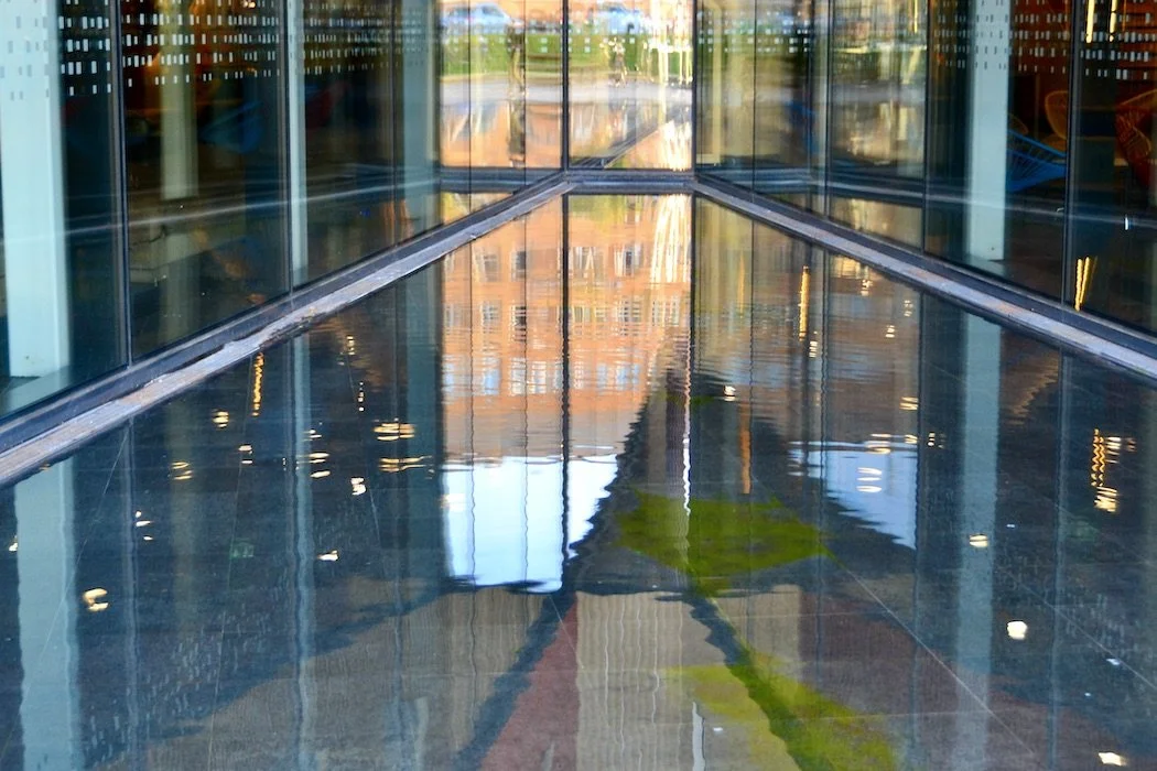 Reflection merging buildings in water