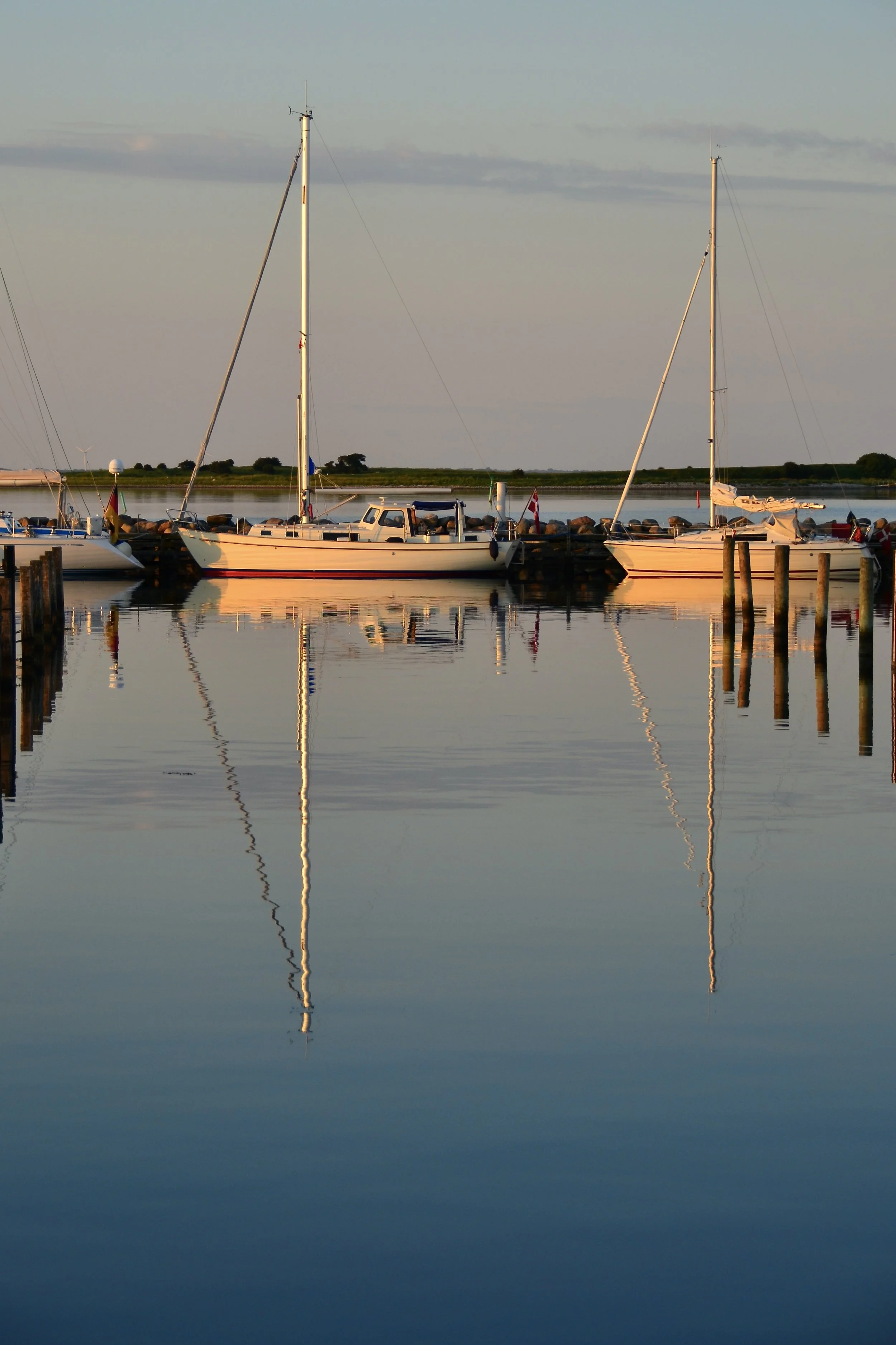 Boats Sunset boat reflections Aeroe Denmark
