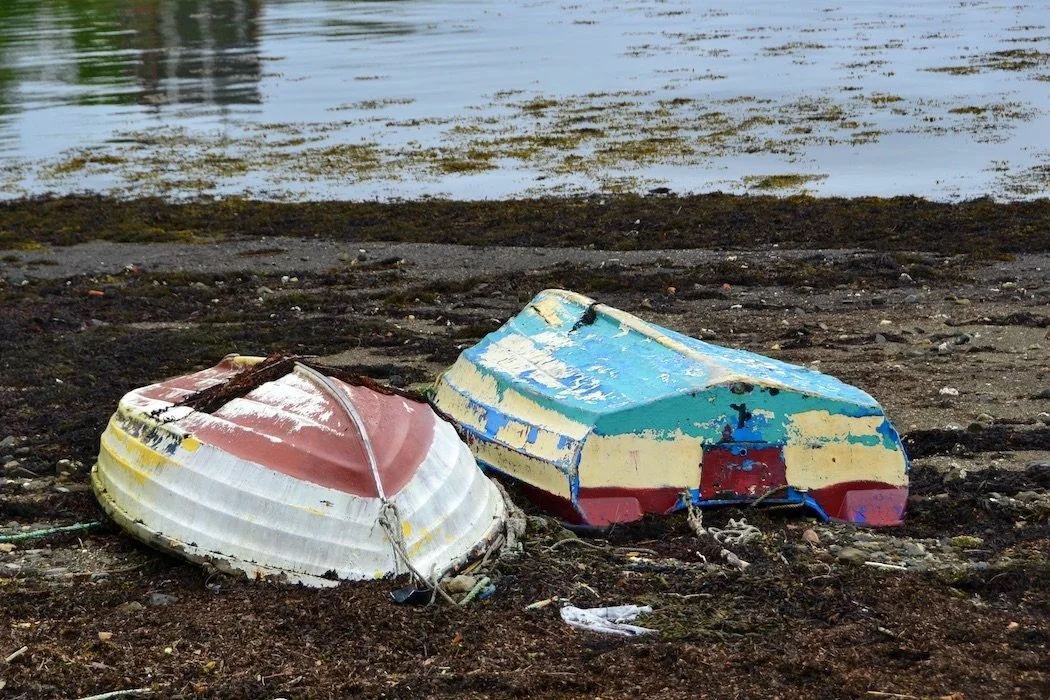 Boats beached dingy Tobermory Scotland