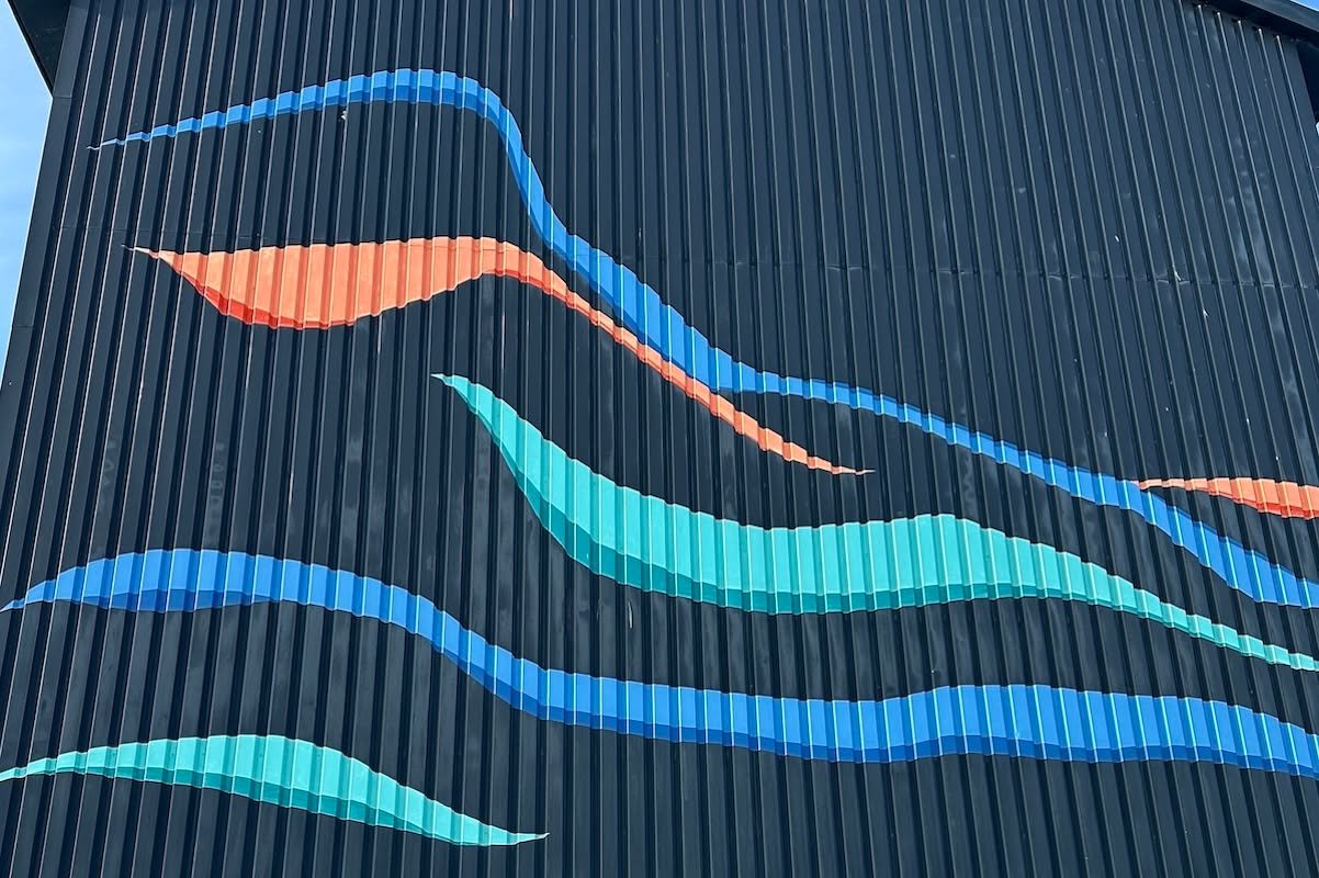 Travel Tips Tuesday inspiration from Ilulissat, where the vibrant Greenlandic art scene is alive indoors at the Art Museum in Inuit objects of whale bone, wood, and metal, and outdoors through the murals spread sound town on the sides of official and