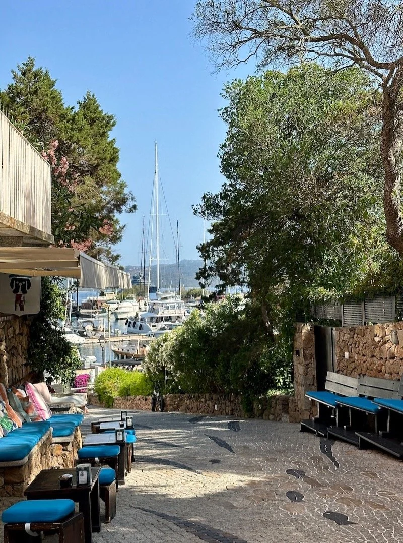 Travel Tips Tuesday inspiration from the Emerald Coast of Sardinia, where a day trip from Olbia to the elegant village of Porto Rotondo, on a peninsula jutting into the emerald sea, offers an opportunity to explore picturesque alleyways on foot to en