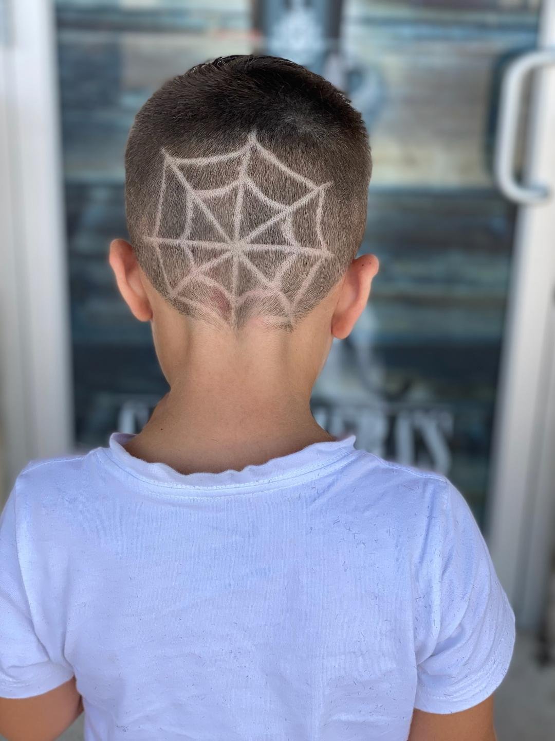 kid haircut with design spiderweb.jpg