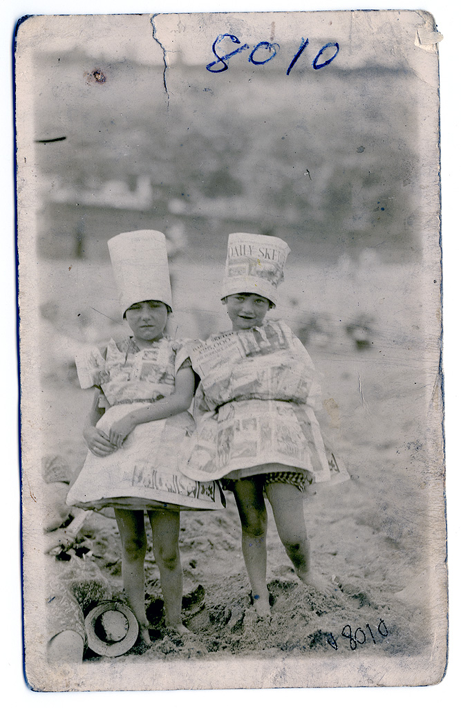 Pope family, taken (possibly) at Ramsgate beach wearing fancy dress newspaper dresses. ©Helene Whitworth