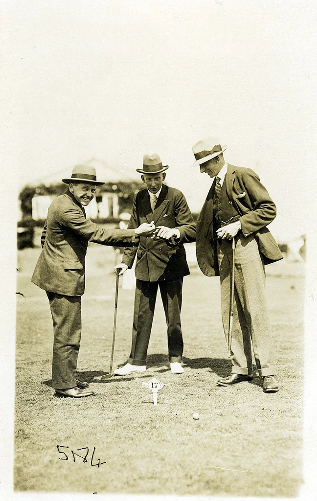 Three men putting. Golf in Margate, Kent. ©Paul Godfrey