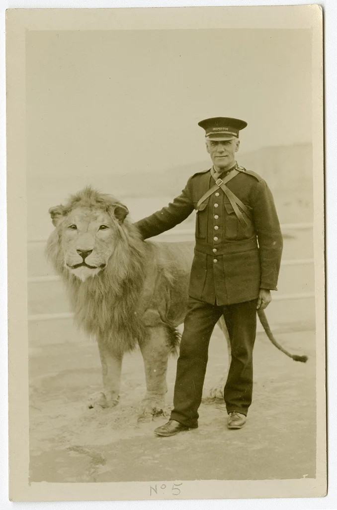 Portrait of a beach inspector standing next to a Sunbeam lion at Palm Bay, Cliftonville, Margate, Kent. ©Ralph Billington ©SEAS Photography