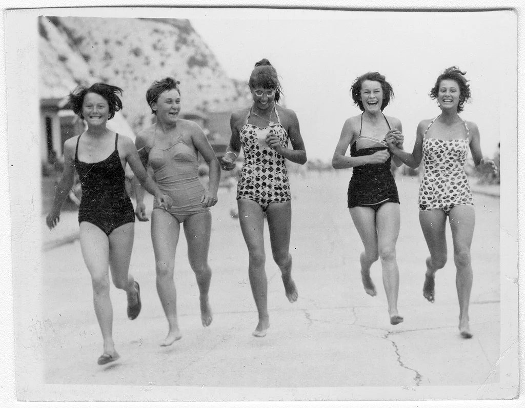 Pat Faulkener, Heather Odd, Michele Morize, Barbara Hunt and Wendy Spenceley running along Western Undercliff, Ramsgate, Kent. 1959. ©Wendy Arnhiem ©SEAS Photography