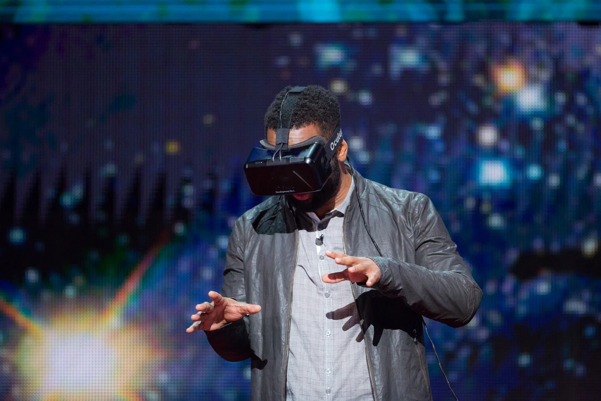Jeremy Bailenson (not shown) demonstrates a virtual reality headset with help from host Baratunde Thurston at TED Talks Live - Science and Wonder, November 5-6, 2015, The Town Hall, New York, NY. Photo: Ryan Lash/TED