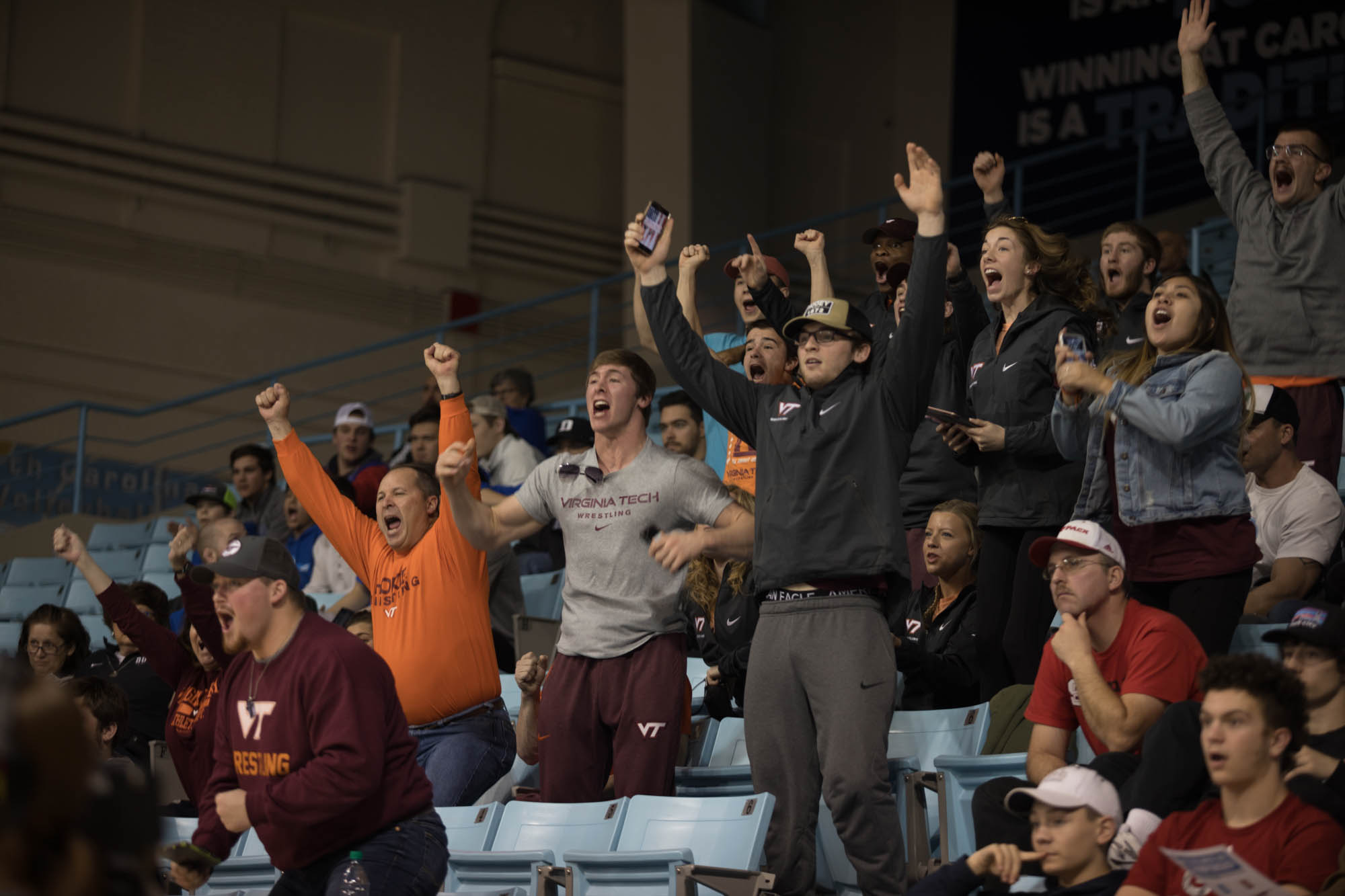 Virginia Tech fans scream in excitement as the Hokies win a match against the Tar Heels during the ACC tournament. Throughout the day the Heels and Hokies would go head to head several times.