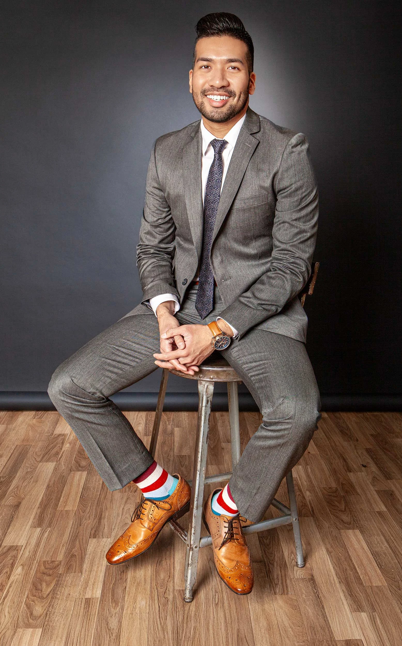 Adam-Ismail-Seated,-Grey-Suite-Portrait---WARM,-BLK-BKGND-0458-MORE-FLOOR-BACKLIGHT-RIM-LIGHT-TEST-+-Dramatic-2.0-FLAT-NEWEST.-2500PX-FOR-SS-WEB. 500KB.jpg