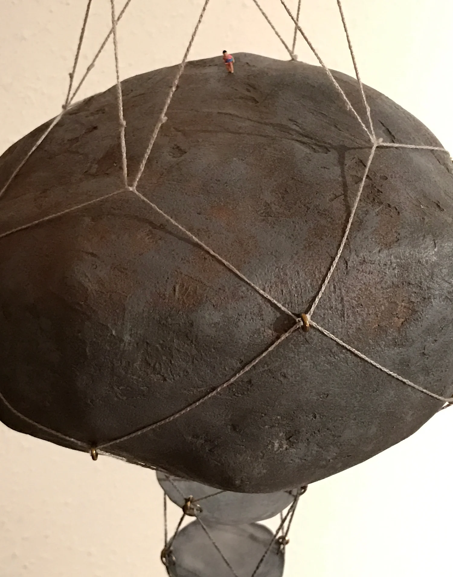 Acrylic, paper mache, cotton, plastic, brass.