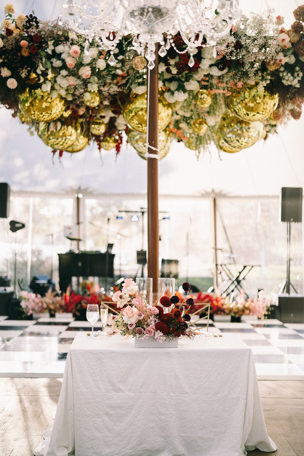 Sweetheart Table Arrangement in Front of Floral Installation