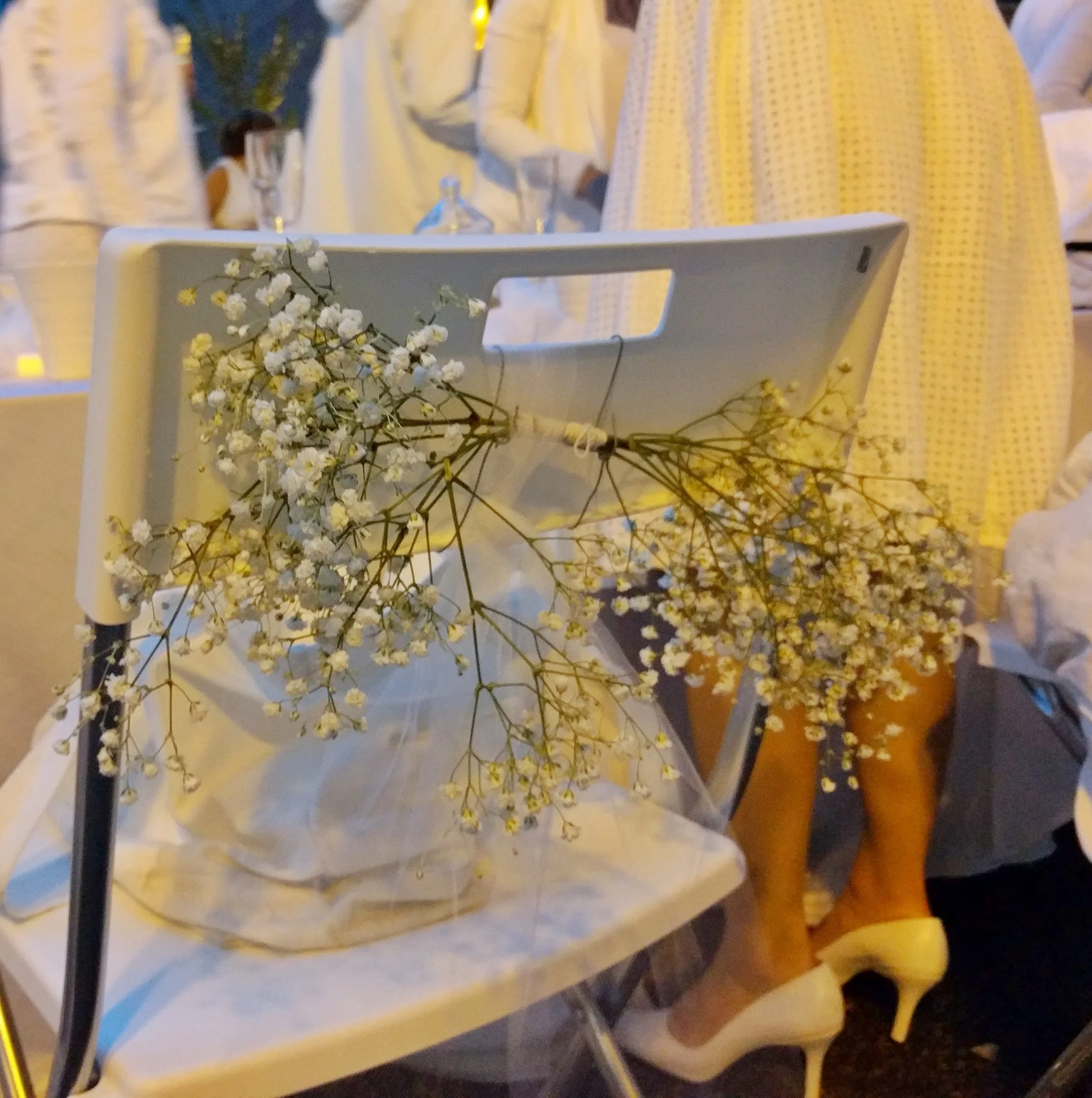 Tulle streamers and bunches of flowers for chair backs - easy to do, and saves table space for delicious food. 