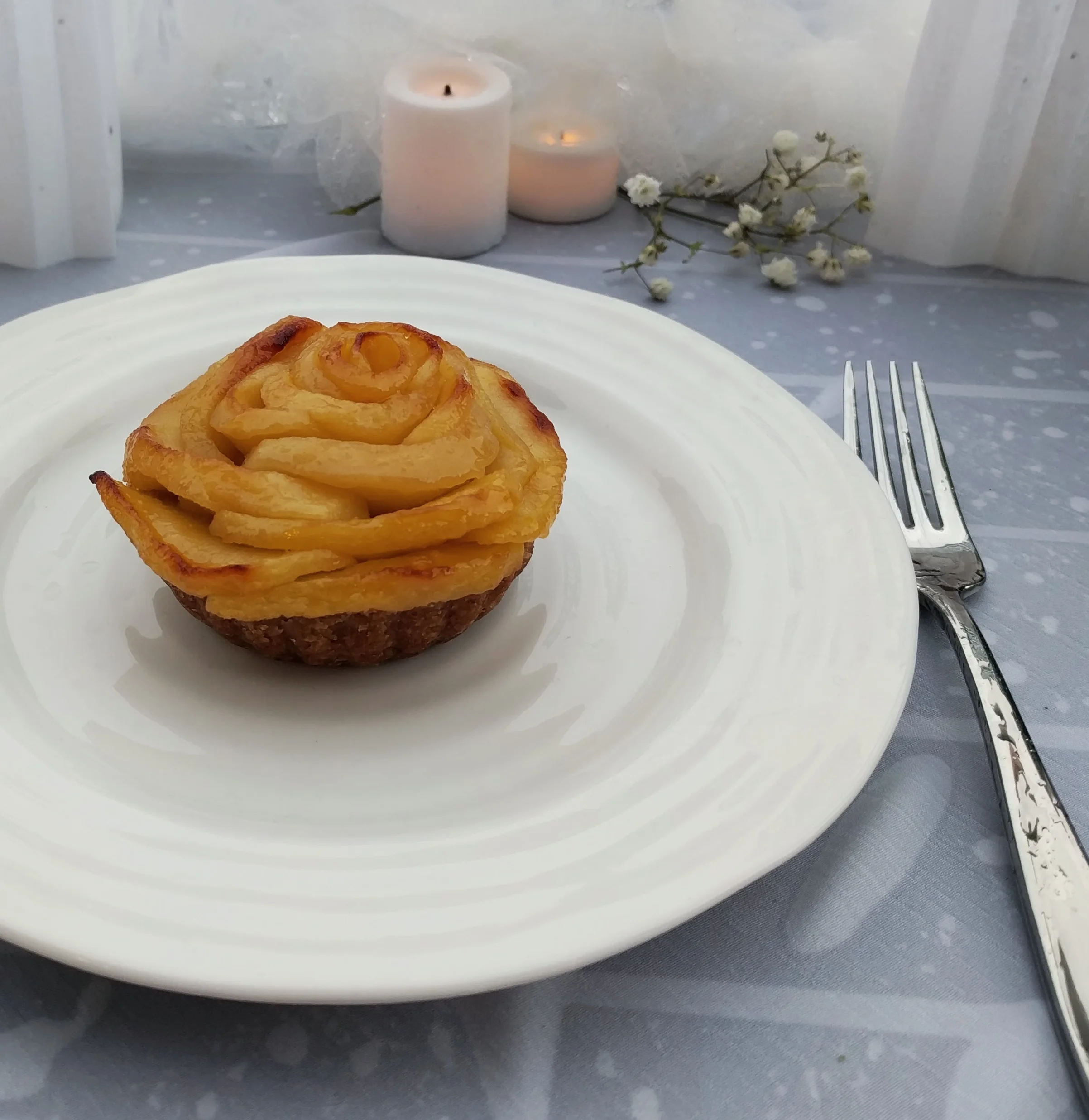 Individual apple and brown butter rosette tarts - the table cloth is soaked from the pouring rain, but they were a lovely end to a meal, and would be even prettier if you can get the apple slices thinner than I did. 