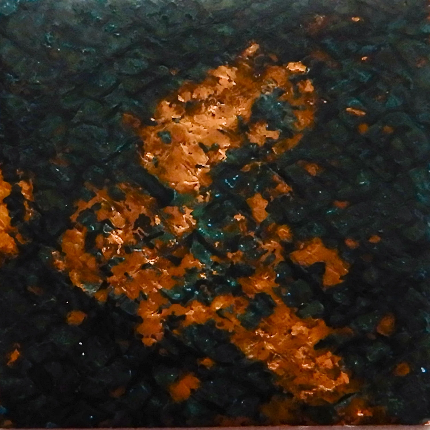 Annealed and sanded by sandpaper and sandblasted. Wrapped in an loose mesh fabric saturated by liver of sulfur, then exposed to ammonia fumes for three days. Size 1 x 1 in