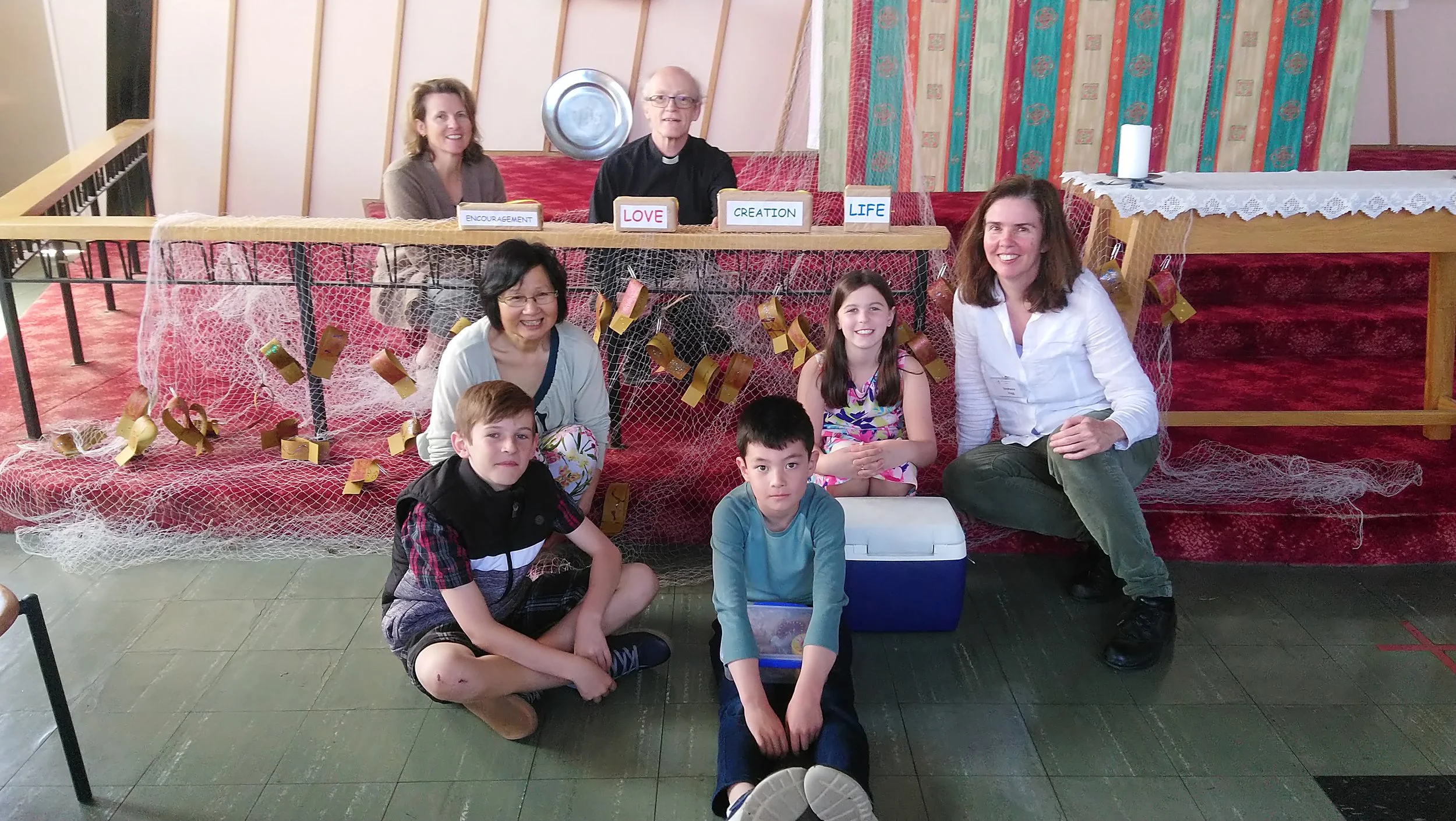 Some folk from our family service organising group this month, pose for a photoshoot with the fish and the net after the service. Great time, everyone!