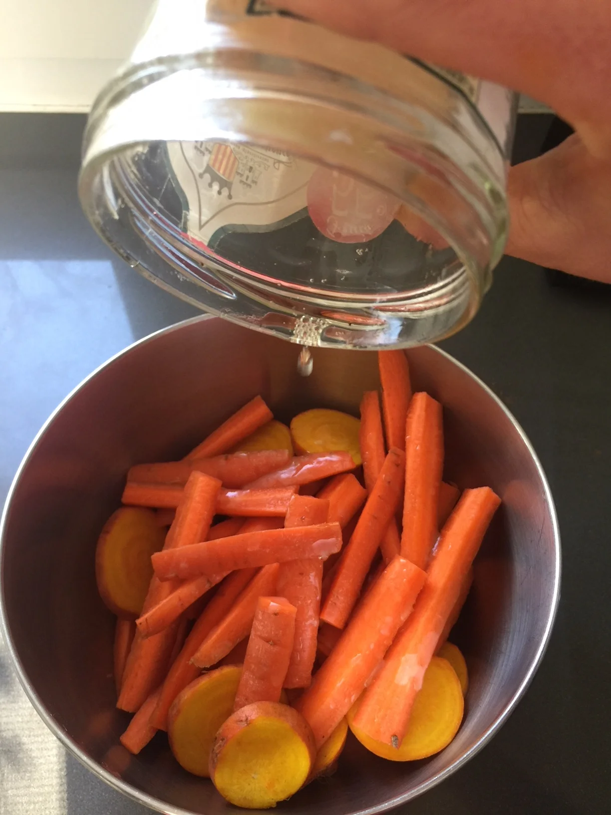 I toss my jar of lard in the pre-heating oven for a minute to melt down the fat, and then coat the wings/ veggies before spreading out on the tray.
