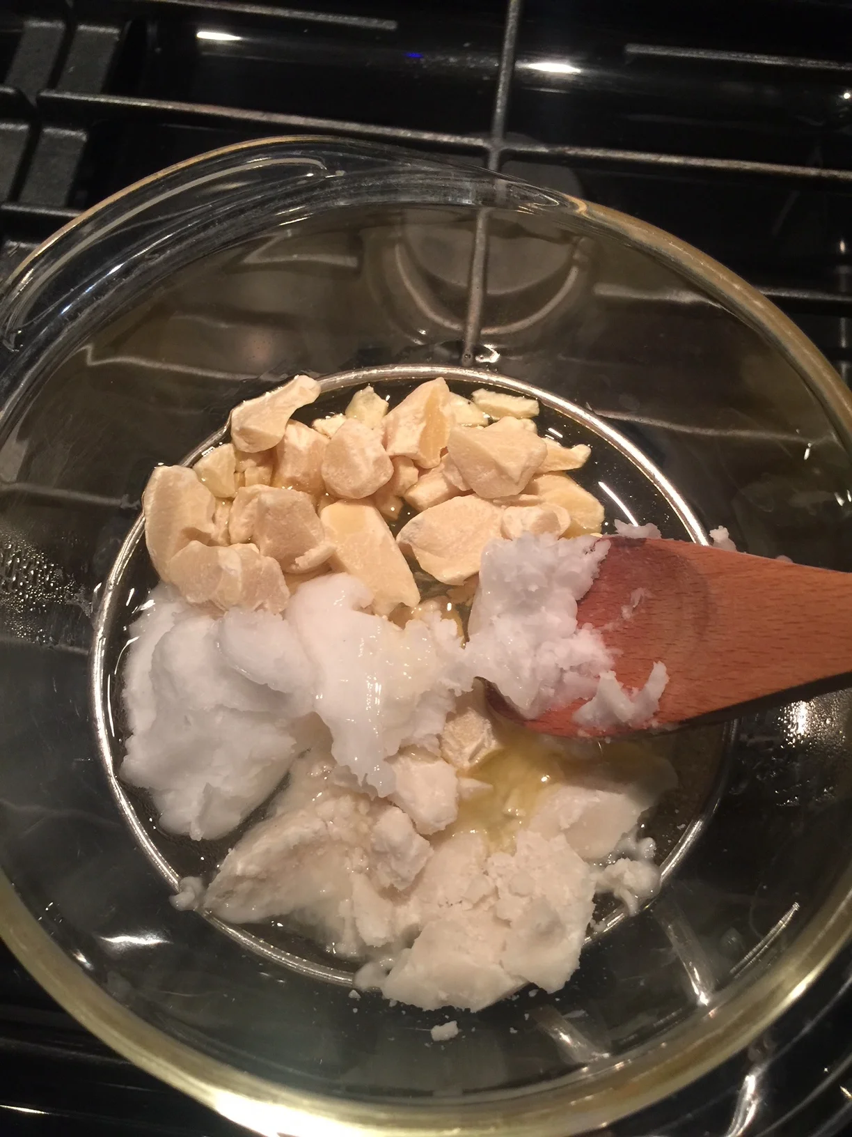 Double broil the butters/ oil by placing a glass bowl on top of a saucepan that contains boiling water. Steam boiling up heats the bowl, and melts the goods.