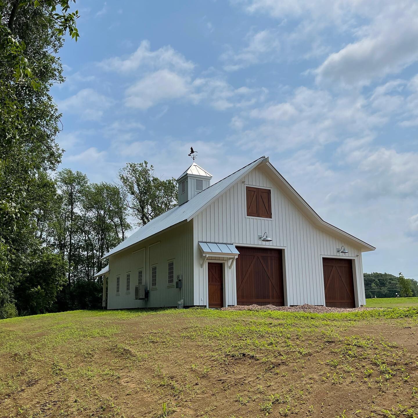 Standing seam roof installed on this beautiful barn for @redhousebuilding 24 gauge Englert &ldquo;galvalume mill finish&rdquo; in fall of 2020&hellip; custom fabricated stainless steel cap on the cupola accepts the weathervane and hip caps for a bull