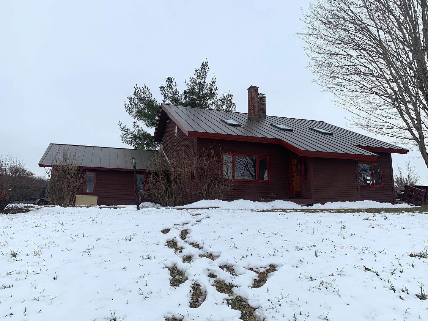 Recently completed standing seam metal roof replacement... Englert 24 gauge in &ldquo;medium bronze&rdquo;, new @veluxusa M08 skylights installed into welded aluminum skylight curbs and chimney cricket powder coated to match roof color