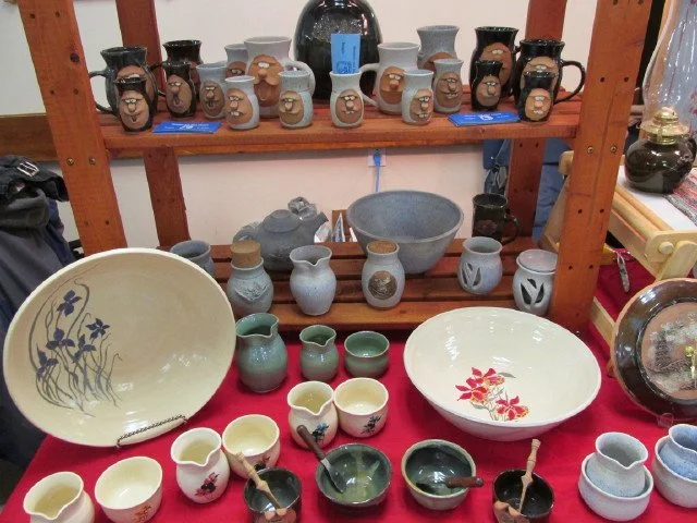  Various bowls and cups on wood shelf &amp; red cloth display 
