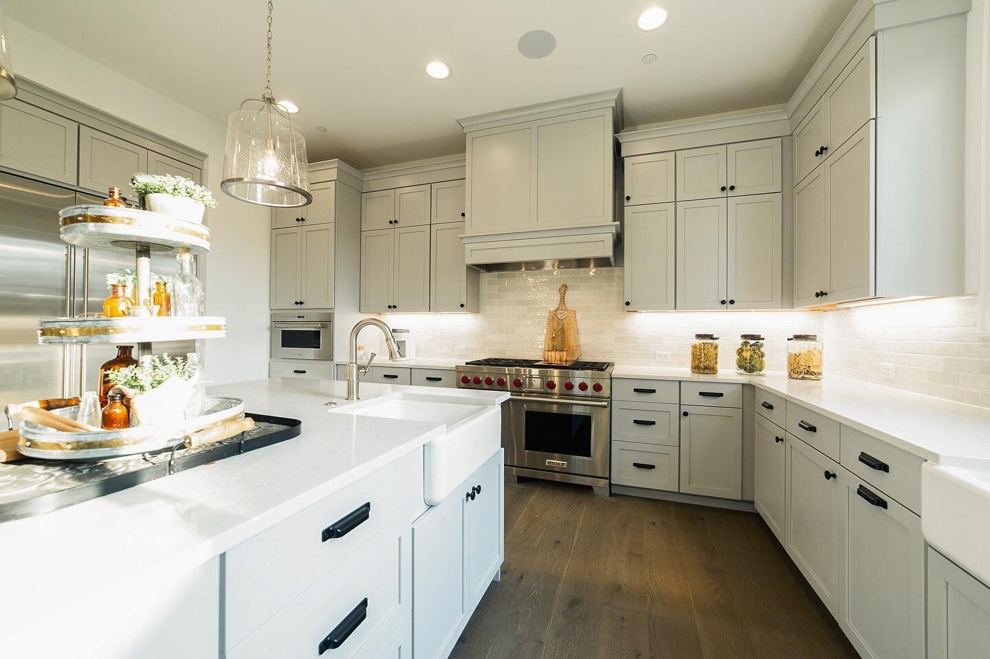 We can&rsquo;t decide what our favorite part of this custom kitchen is 😍 Did you notice the mini farm prep sink?! 
Cabinets: @canyoncreekcabinetco Maple w/ Fog paint
Hardwood: @metropolitanfloors Elements Plateau Brushed Oak Silverback
Backsplash: @