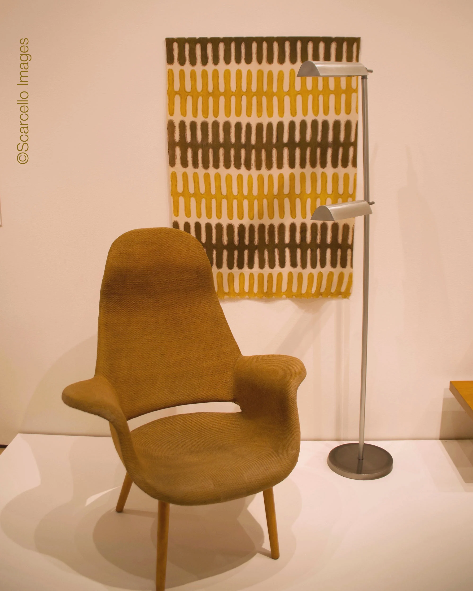 Arm chair by Eero Saarinen and Charles Eames. Hanging fabric by Virginia Nepodal. Lamp by Peter Pfisterer. All 1940.