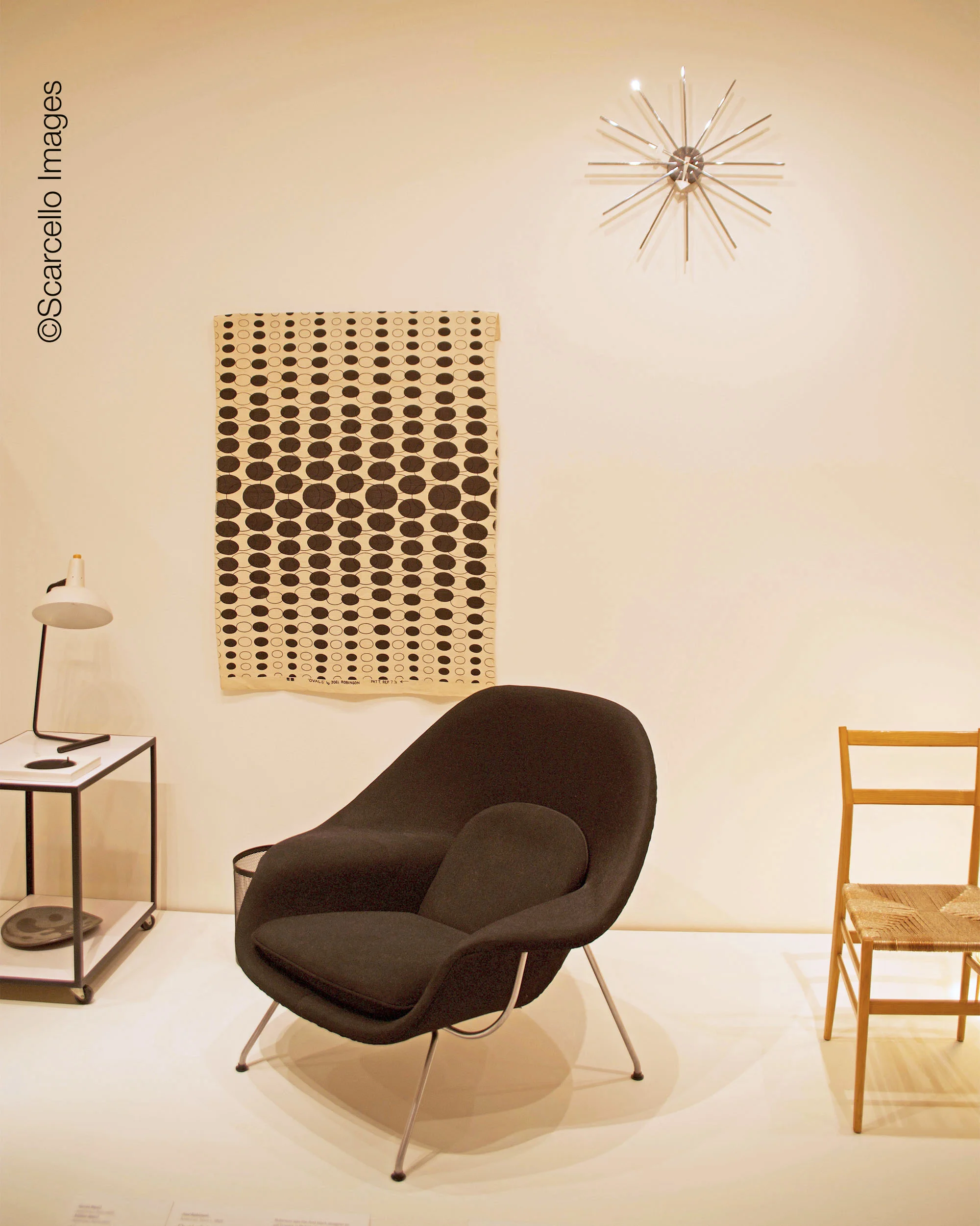 Eero Saarinen’s iconic Womb Chair for Knoll. This one was in the 1951 Milan Triennale. Plus work by Gio Ponti, George Nelson and Joel Robinson.