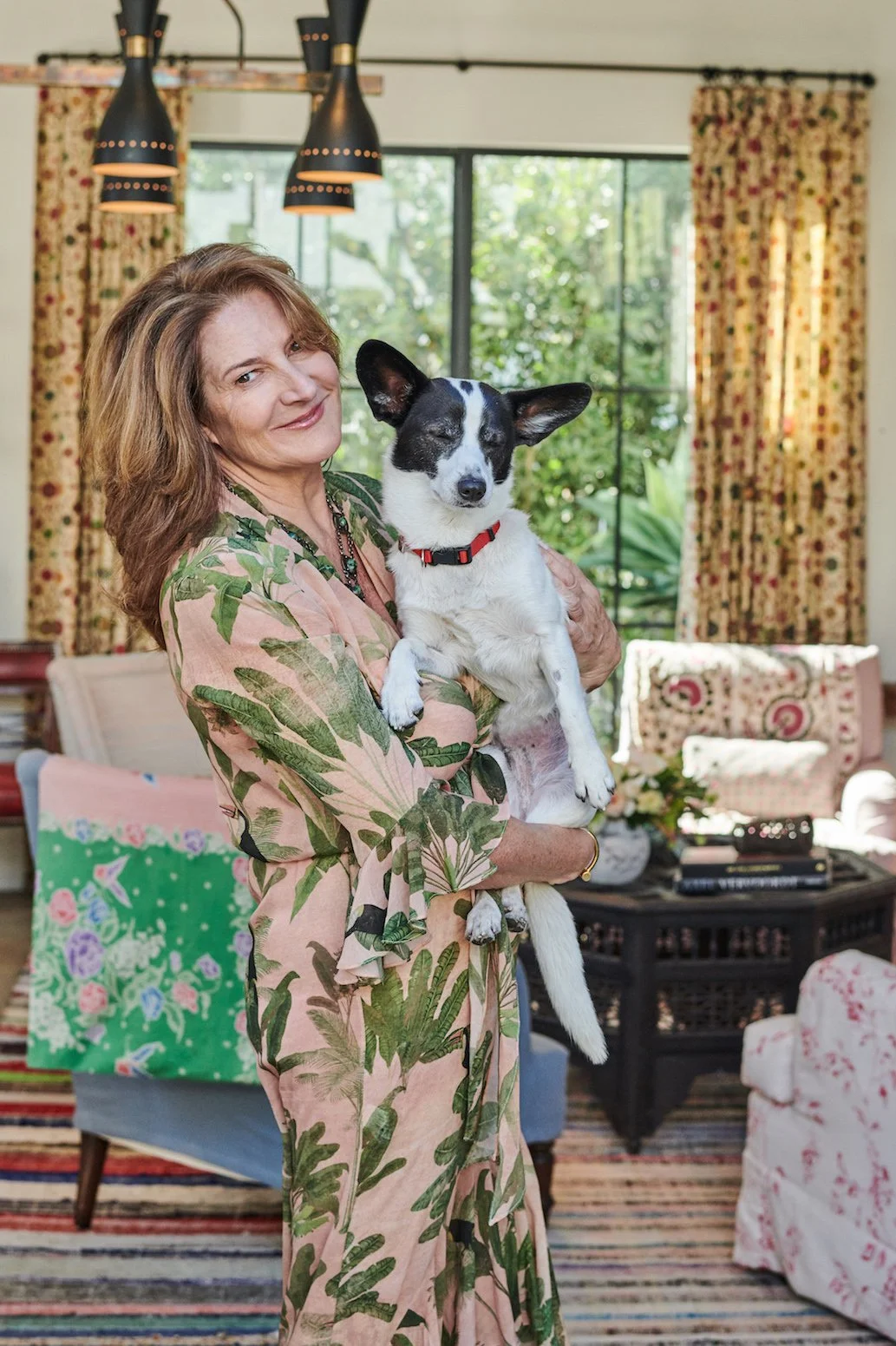 Portrait of Designer Kathryn M. Ireland holding her dog Buster