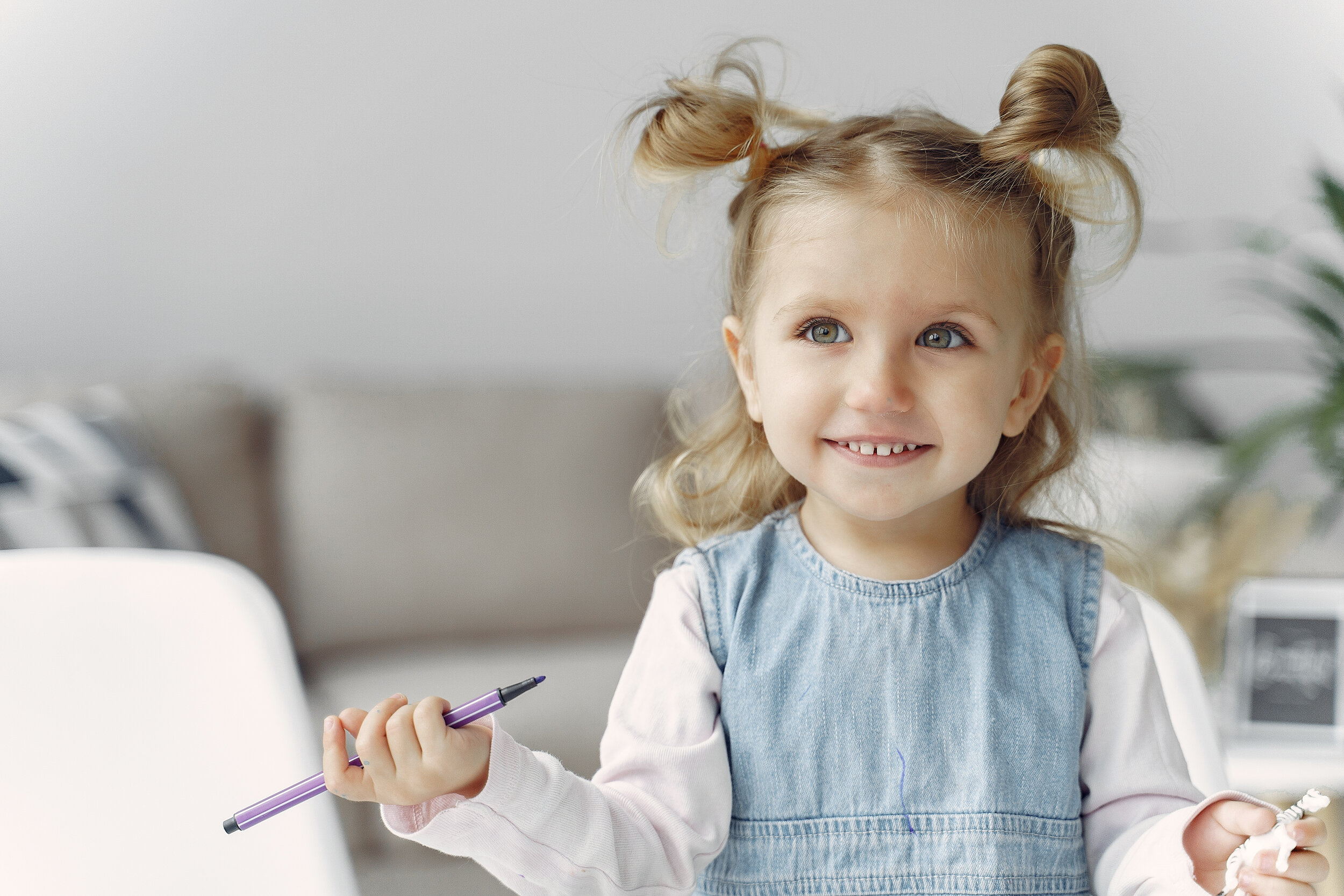 Canva - Cute Little Girl Holding Purple Color Pen.jpg