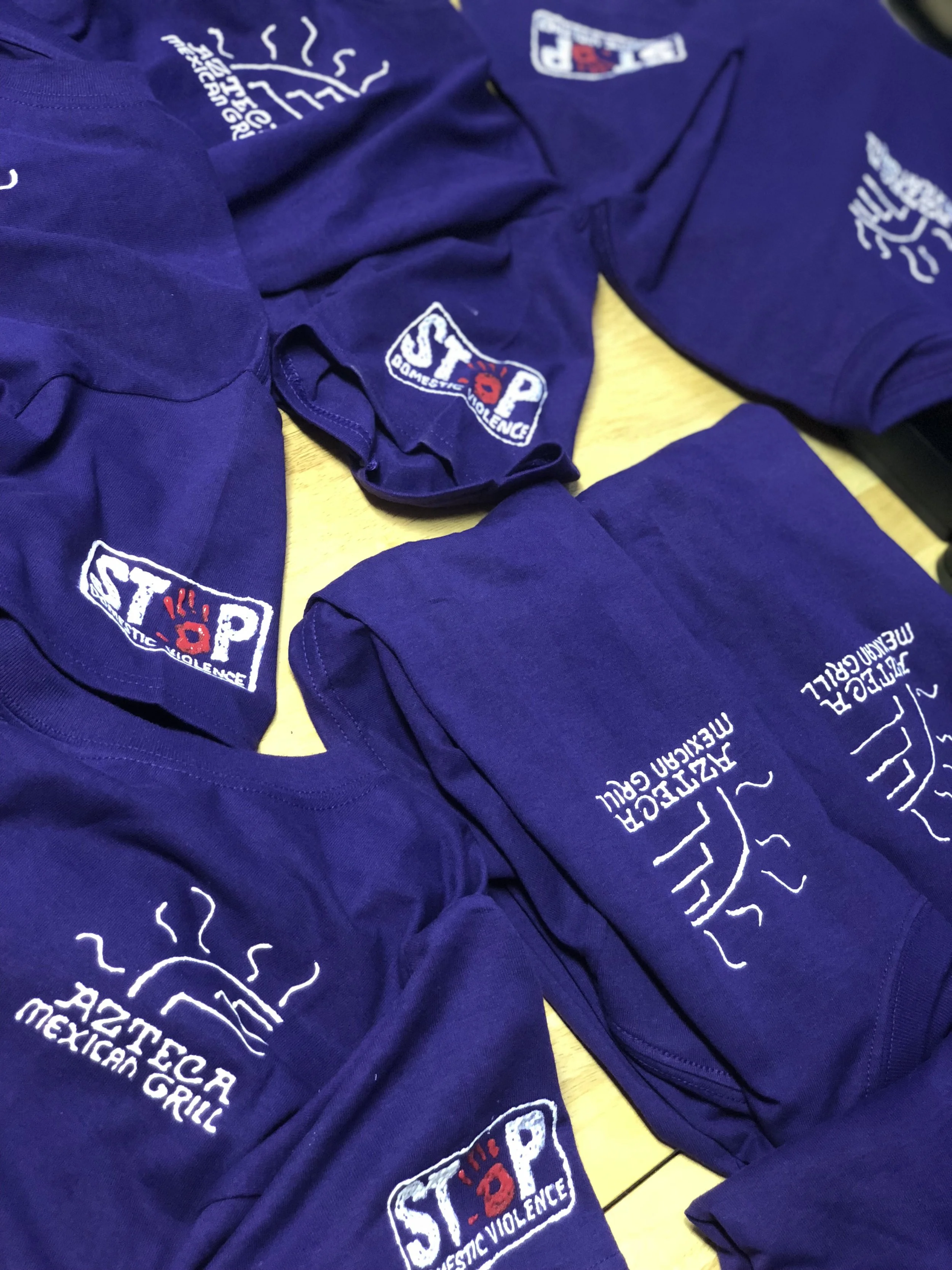 Azteca's Wear Purple Day shirts