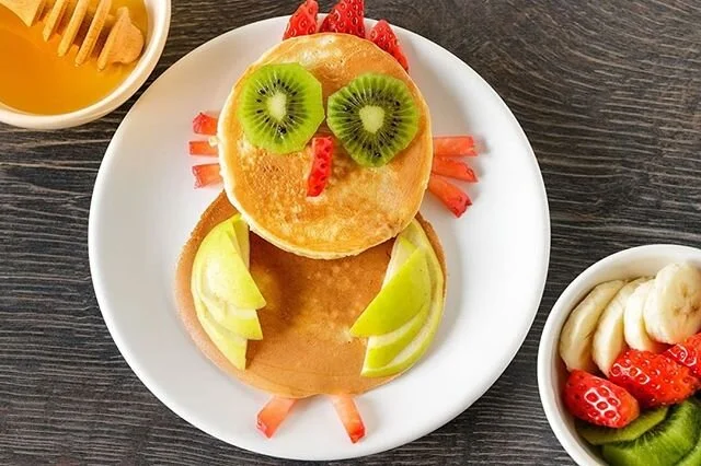 Weekend breakfast idea: Cut up different pieces of fruit and anything else your kids will eat and let them make fun animals out of pancakes!